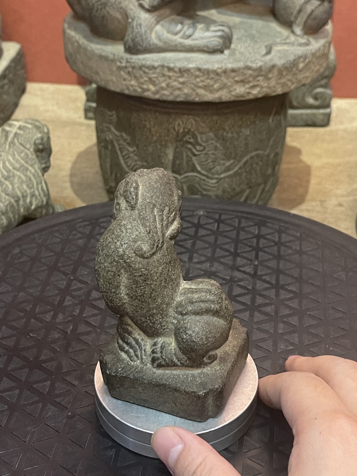 Carved Stone Crouching Guardian Beast on Stepped Base