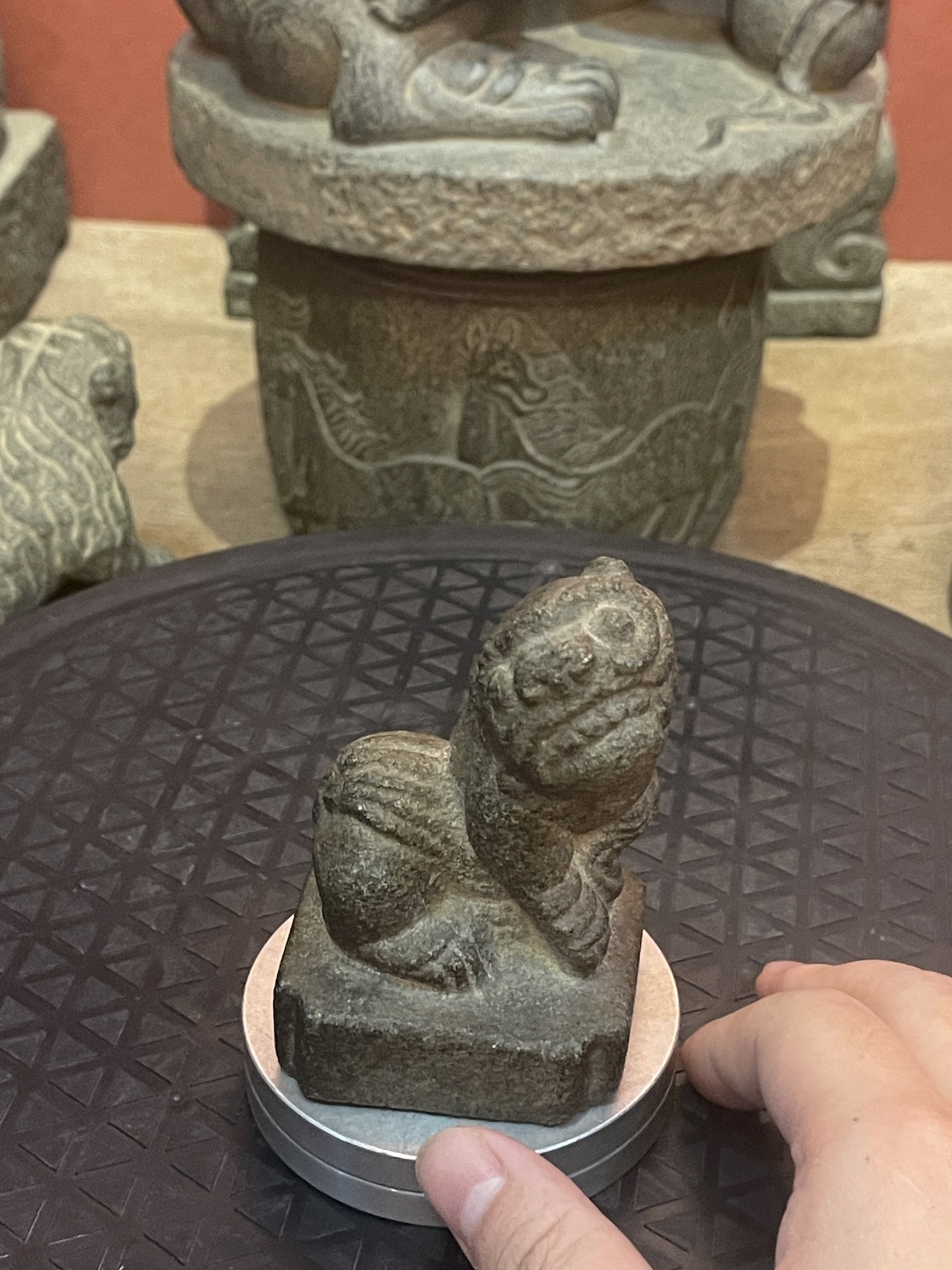 Carved Stone Crouching Guardian Beast on Stepped Base