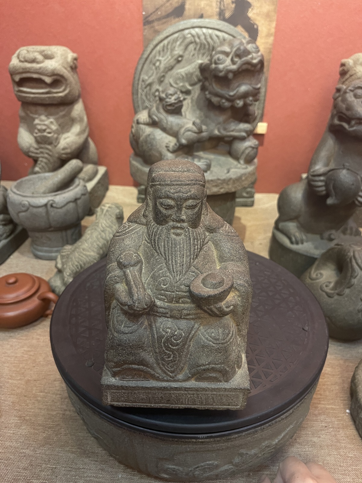Carved Stone Seated Elder in Relief Panel