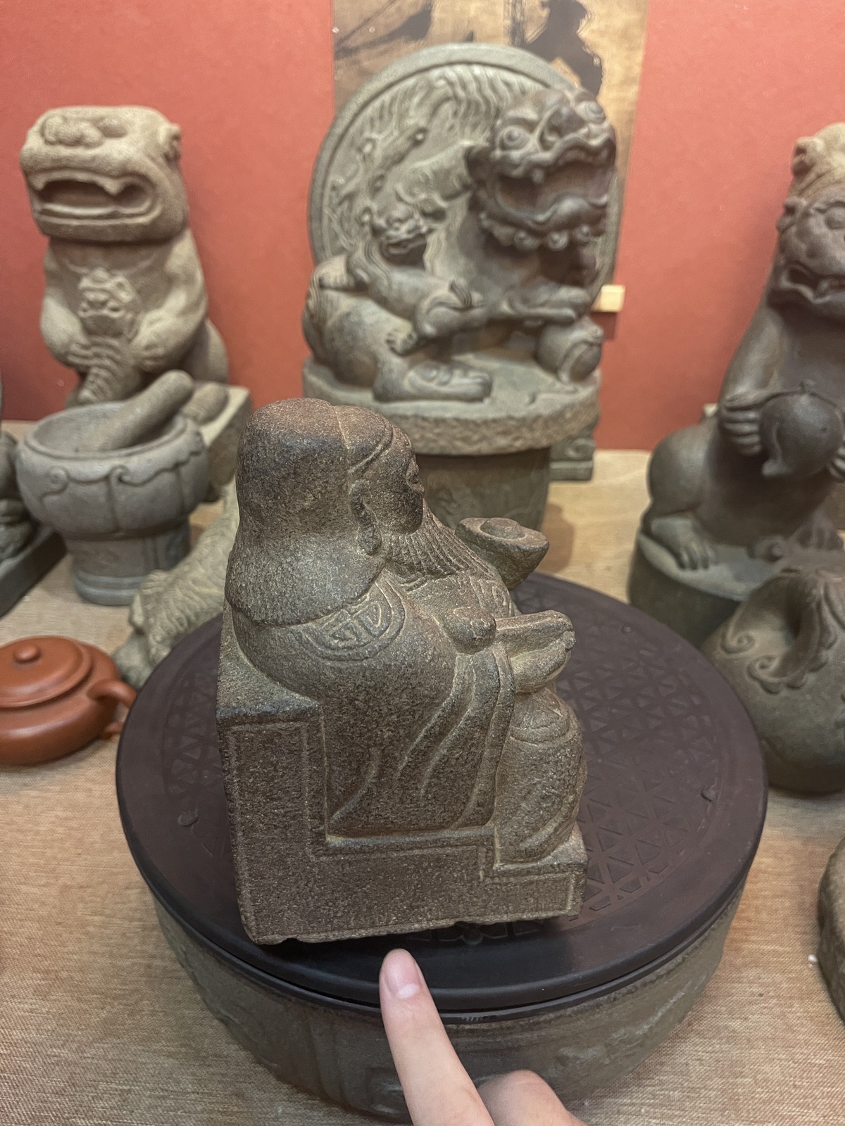 Carved Stone Seated Elder in Relief Panel