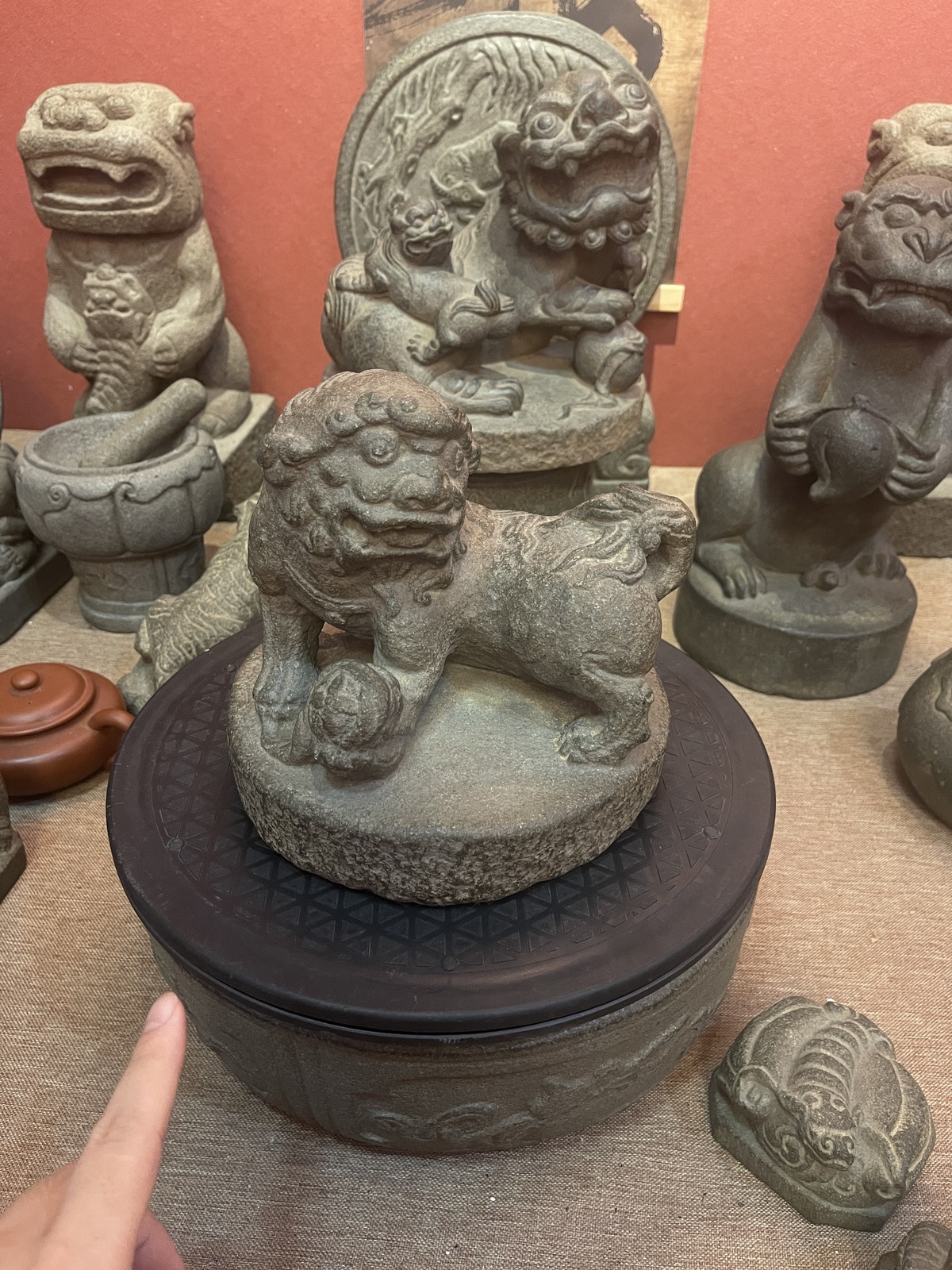 Carved Stone Guardian Lion with Ball on Round Base