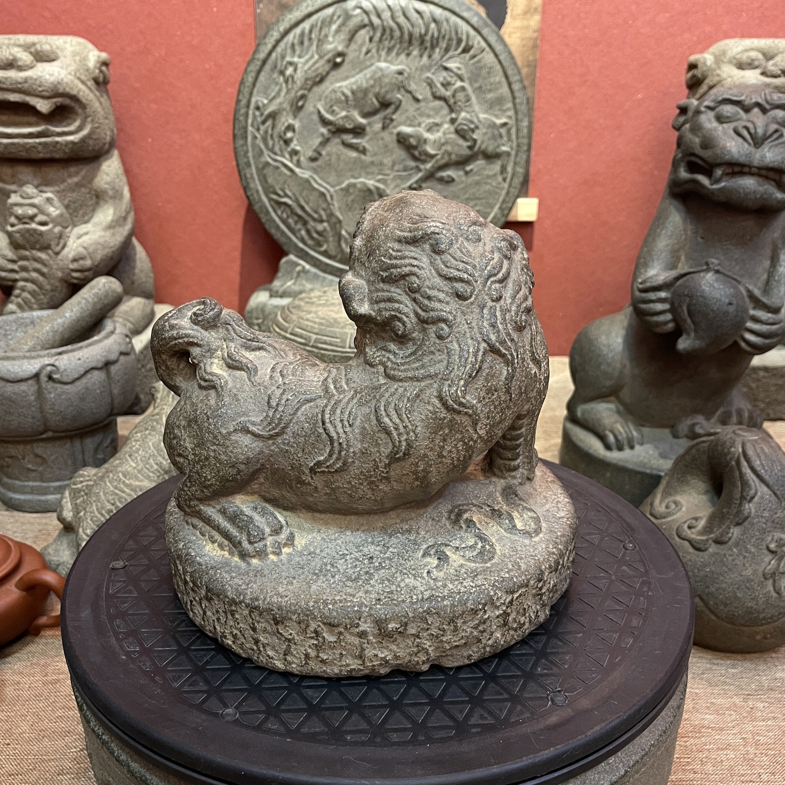 Carved Stone Lion with Brocade Ball