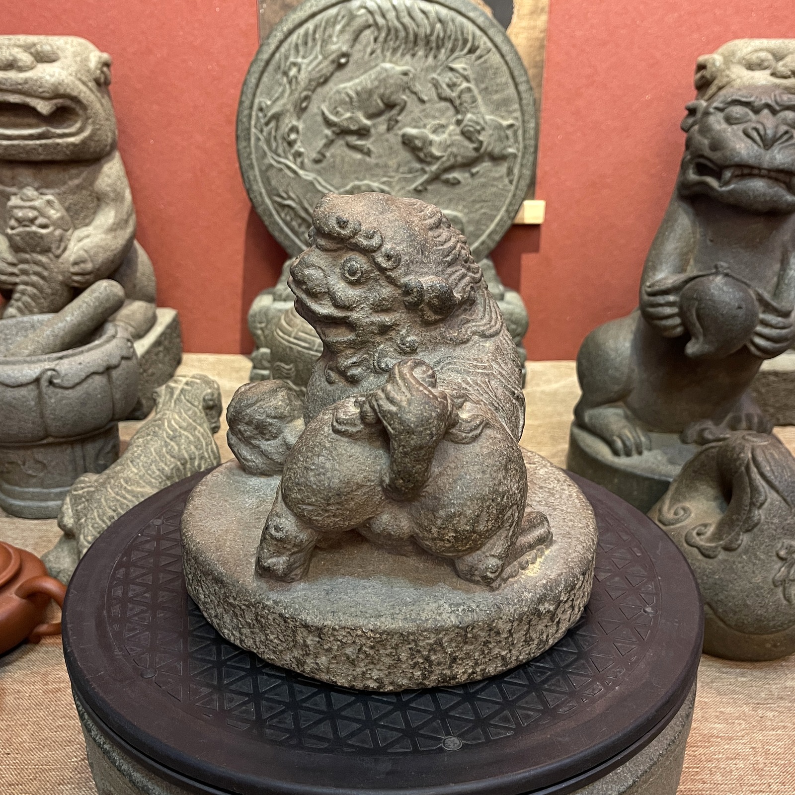 Carved Stone Lion with Brocade Ball