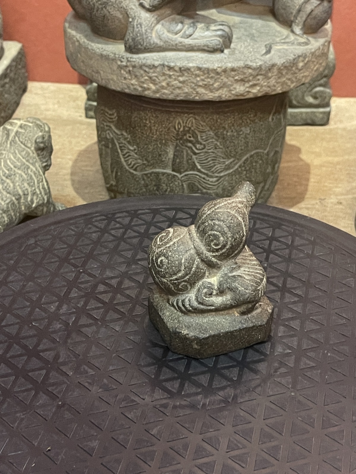 Carved Stone Reclining Beast on Integral Base