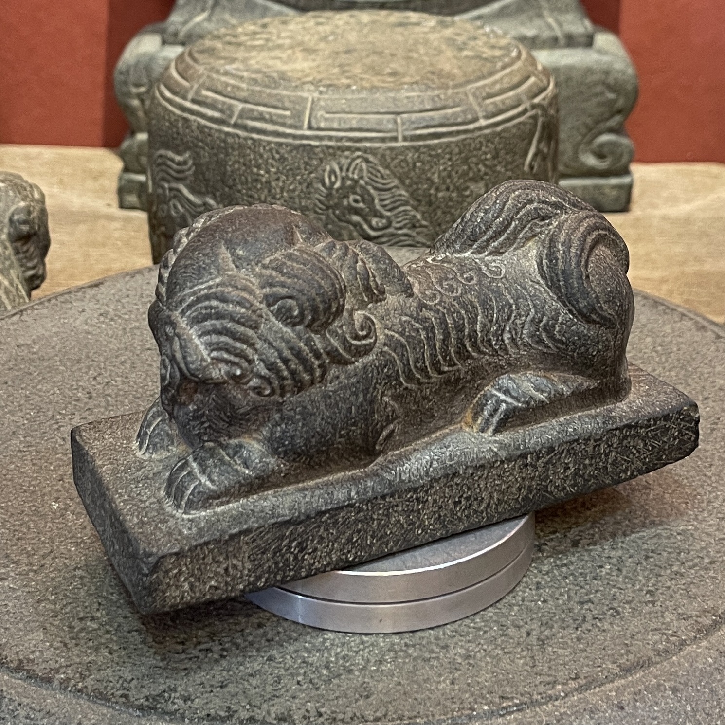 Carved Stone Reclining Lion on Rectangular Base