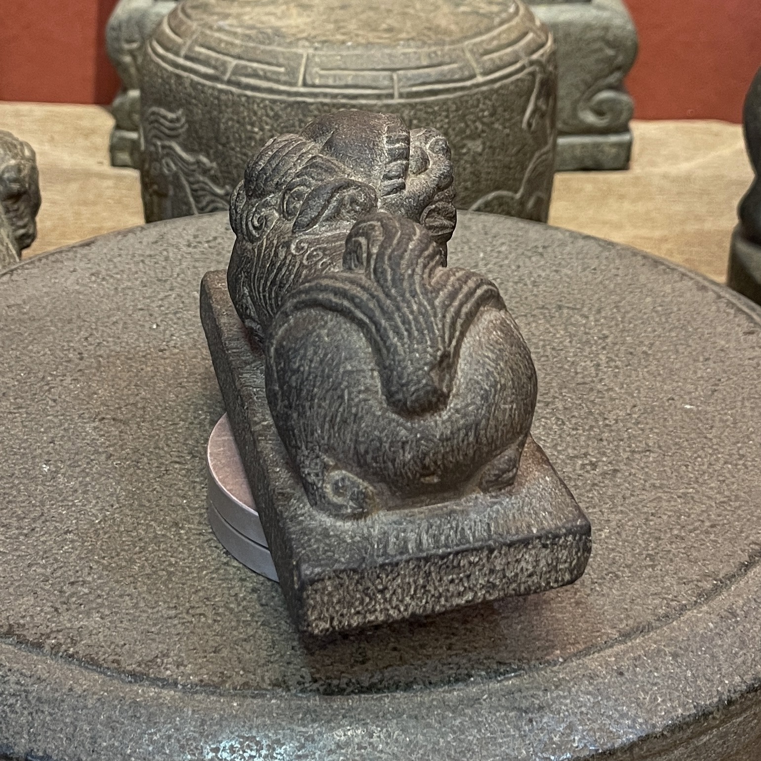Carved Stone Reclining Lion on Rectangular Base