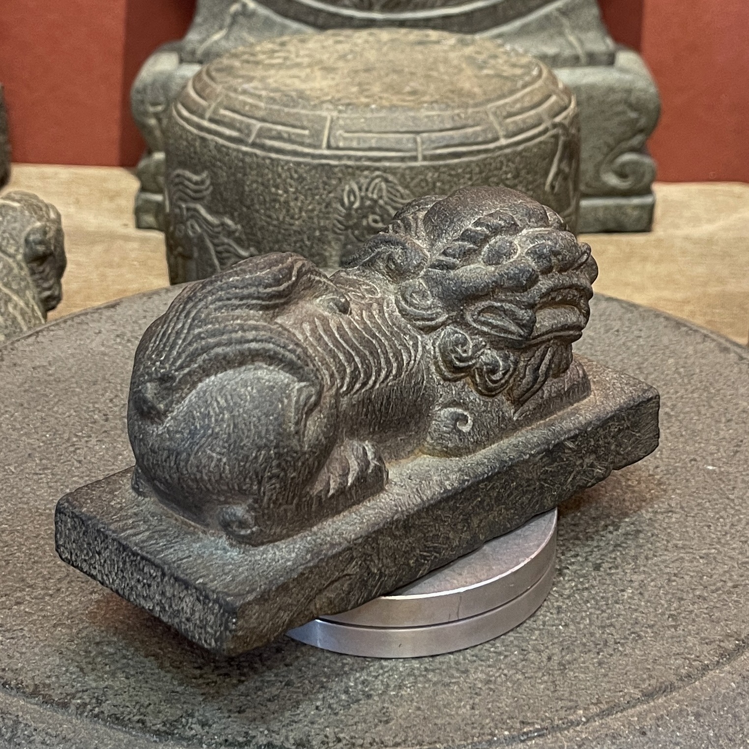 Carved Stone Reclining Lion on Rectangular Base