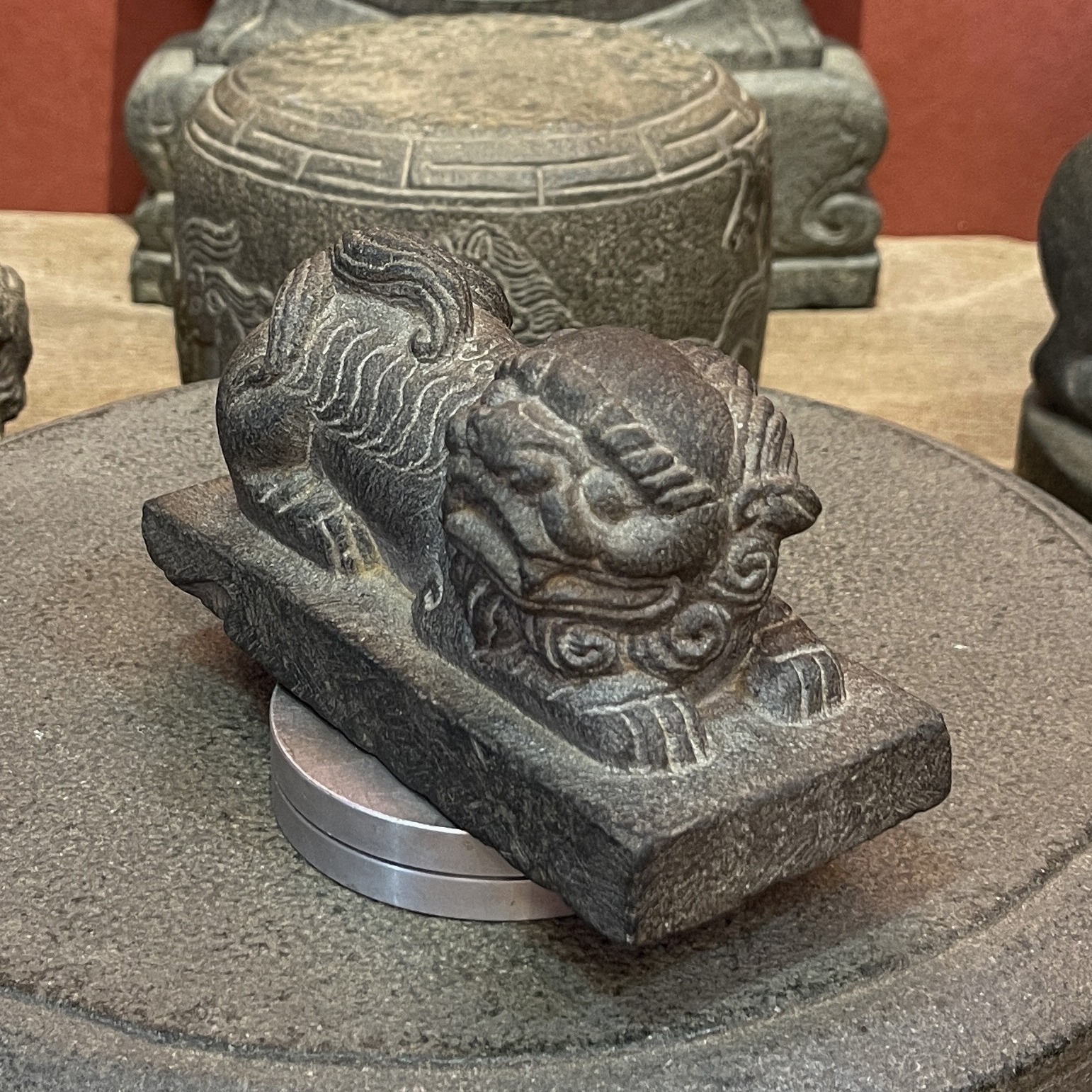 Carved Stone Reclining Lion on Rectangular Base