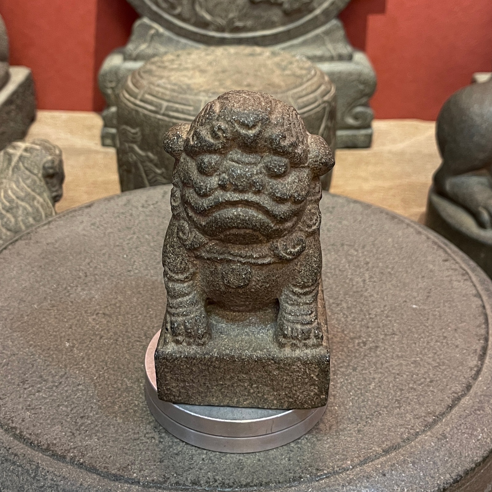 Carved Stone Seated Lion on Square Base
